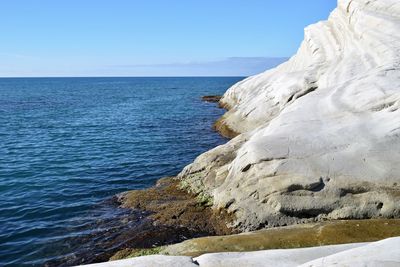 Scenic view of sea against clear blue sky