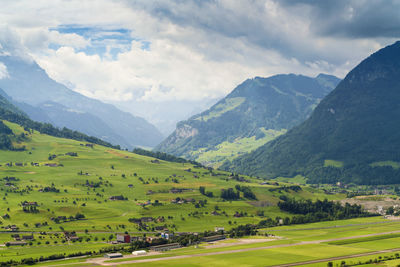 View of countryside fields and mountains near lucerne