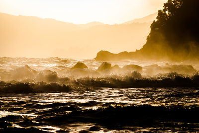 Waves splashing on rocks