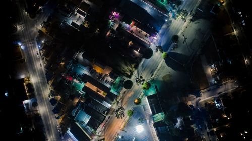 High angle view of illuminated city street at night