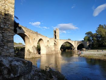 Arch bridge over river