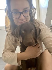 Portrait of teenage girl with dog