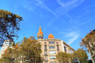 Low angle view of building against blue sky