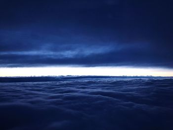 Scenic view of sea against storm clouds