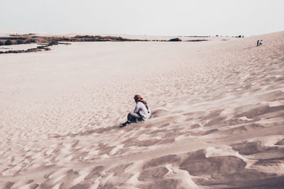 Full length of man on beach against sky