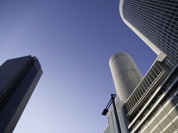 Low angle view of skyscraper against clear sky