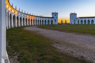 Sunset between the columns. ancient residence of the doge of venice. udine. italy