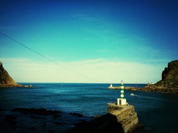 Scenic view of sea against blue sky