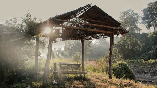 Built structure on field against sky