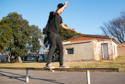 Young skateboarder sliding