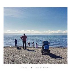 Rear view of people on beach