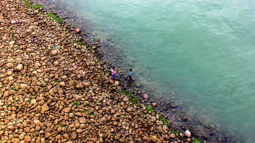 High angle view of stones on beach