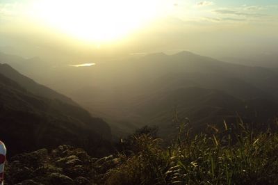 Scenic view of mountains against sky during sunset