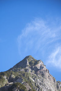 Low angle view of rock formation against sky