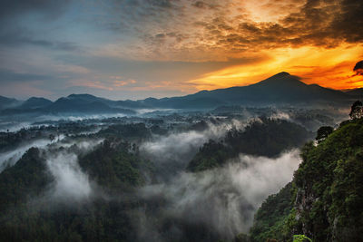 Scenic view of mountains against sky during sunset