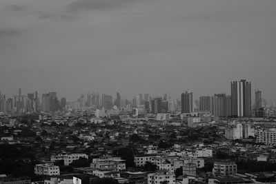 High angle view of buildings in city against sky