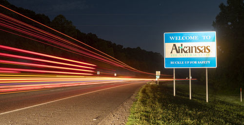 Light trails on road in city at night