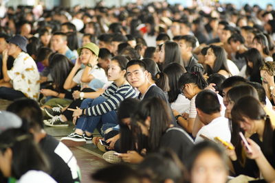 High angle view of people sitting in city