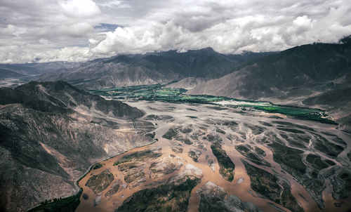 Aerial view of landscape and mountains against sky