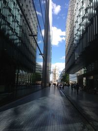 Street amidst buildings in city against sky