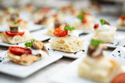 Close-up of pizza and focaccia in plate