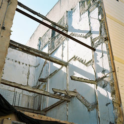 Low angle view of construction site against sky