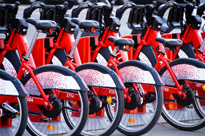 Red bicycles parked in row