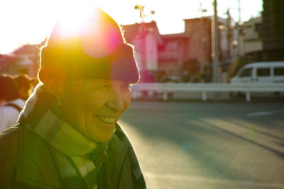 Portrait of smiling man in city