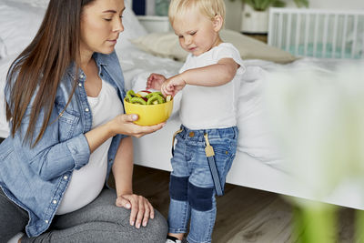 Mother and daughter holding ice cream