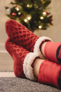 Low section of person wearing red socks during christmas