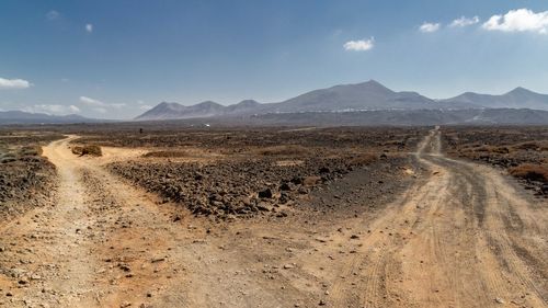 Scenic view of volcanic desert against sky