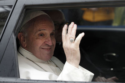 Portrait of smiling man sitting in car