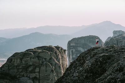 Man standing on mountains against sky