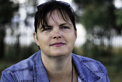 Close-up of woman looking away at park