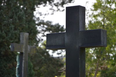 Close-up of cross on cemetery