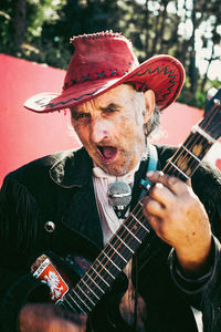 Portrait of man playing guitar