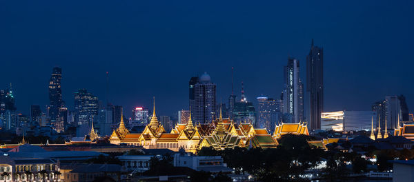 Illuminated buildings in city at night