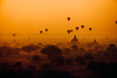 View of hot air balloons against sky during sunset