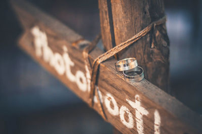 Close-up of text on wood with rings