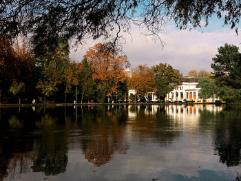 Scenic view of lake by trees against sky during autumn