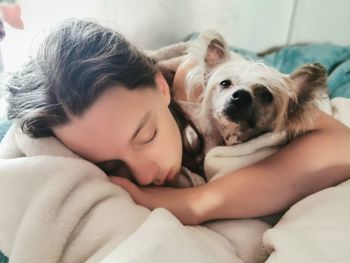 Dog lying on bed