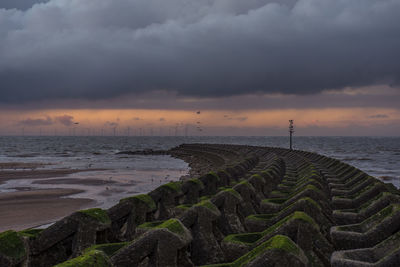 Scenic view of sea against sky at sunset