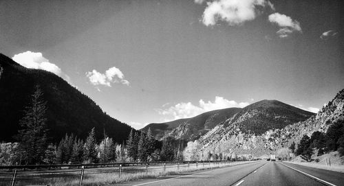 Country road leading towards mountains