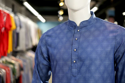 Close-up of kurta on mannequin for sale in store
