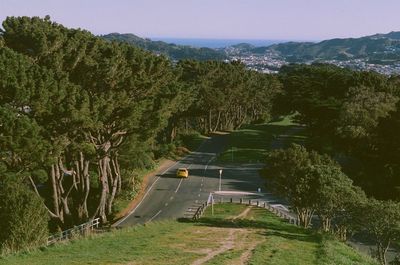 High angle view of yellow car on road against clear sky