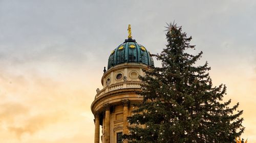 Low angle view of building against sky during sunset