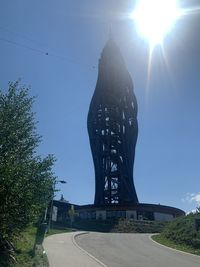 Low angle view of statue against clear sky on sunny day