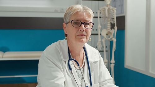 Portrait of senior doctor at hospital