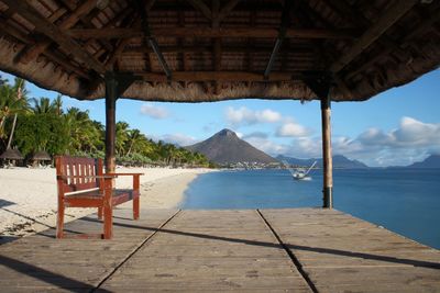 View of chairs on beach