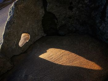 Close-up of cave against sky